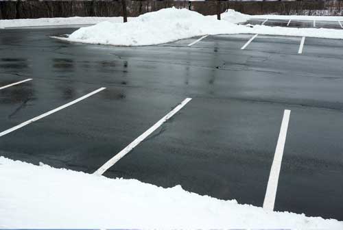 Commercial parking lot cleared of snow in Calgary by Ramshaw Landscaping